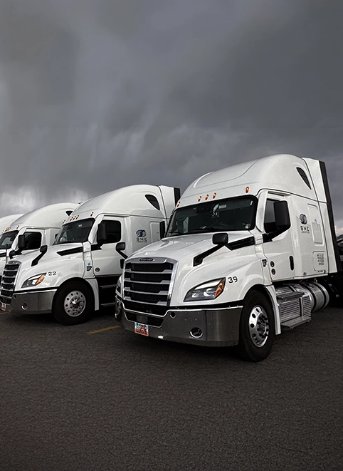 White SME Logistics trucks in a row